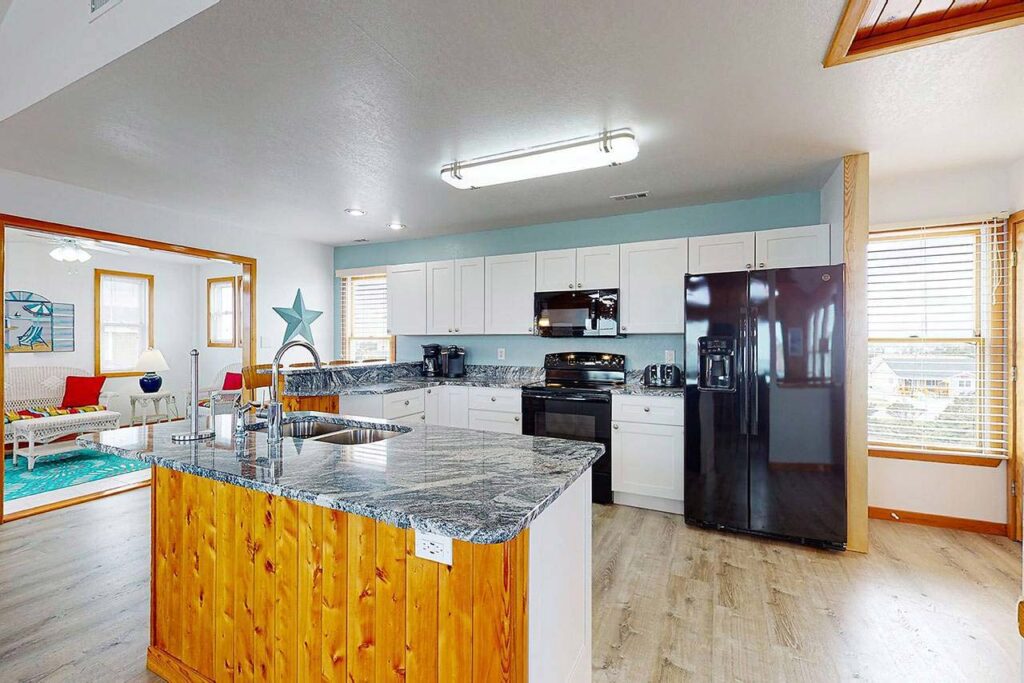 Fully equipped kitchen with granite countertops on main level