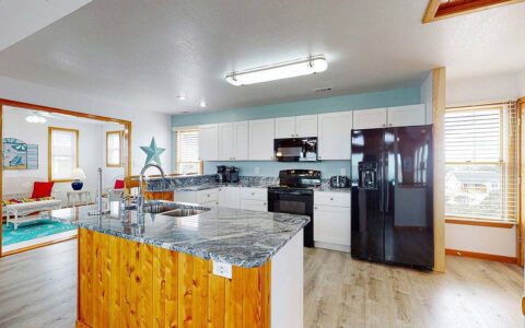 Fully equipped kitchen with granite countertops on main level